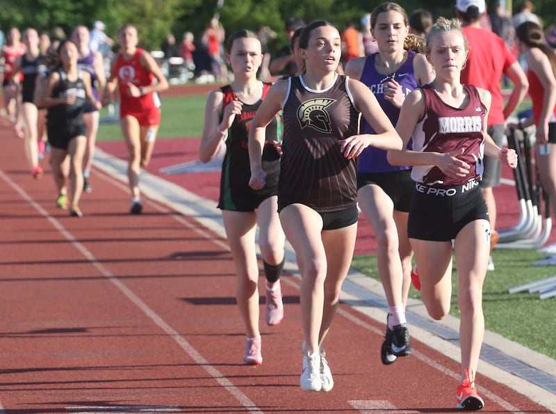 (From left) L-P's Delani Duggan, Sycamore's Layla Janisch, Rochelle's Kyrie Cragin and Morris's Aubrey Lines compete in the 800 meter run during the Interstate 8 Conference girls track championship on Friday, May 9, 2025 at Morris High School.