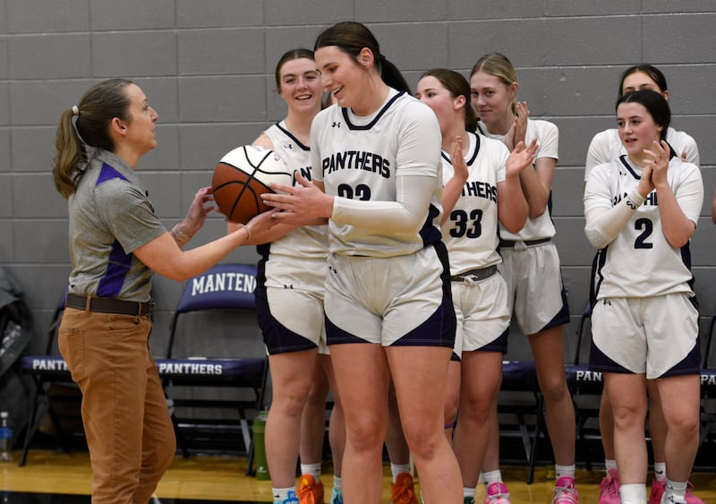 Manteno's Maddie Gesky accepts a ball from head coach Bethany Stritar, left, after becoming the school's all-time leading scorer in a game against Herscher on Thursday, January 15, 2026.