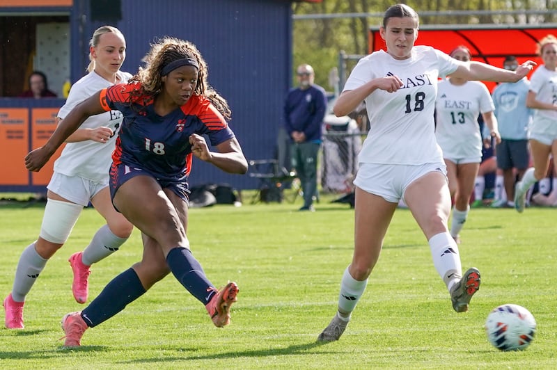 Oswego’s Jordyn Washington (18) shoots the ball for a goal against Oswego East during a soccer match at Oswego High School on Tuesday, April 29, 2025.