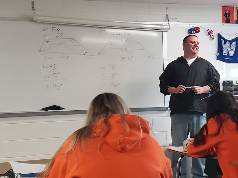 In addition to teaching six levels of math at Gardner-South Wilmington High School, Allan Wills also coaches the math team, is head coach of the varsity baseball and boys basketball teams and runs a recently formed chess team.
