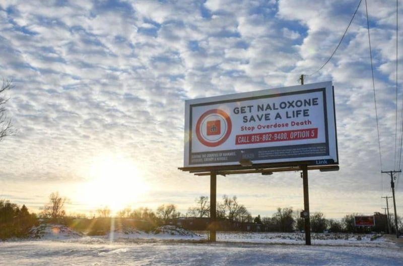 A billboard displays “Get naloxone, save a life” along with the number to call on East Court Street in Kankakee. With the help of opioid overdose education and the distribution of naloxone, also known as Narcan, Kankakee County saw a 52% decrease in overdose deaths last year, dropping from 34 to 20.