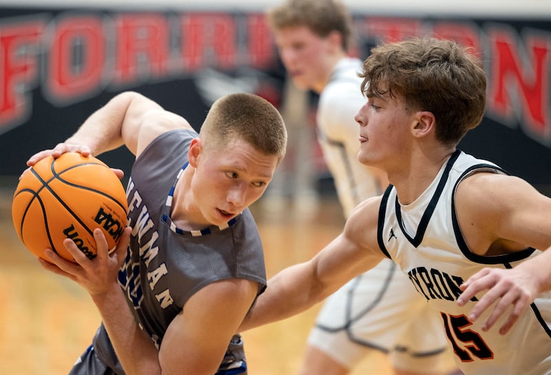 Newman’s George Jungerman works against Byron’s Ben Hively Friday, Dec. 19, 2025, in the Forreston Holiday Tournament title game.