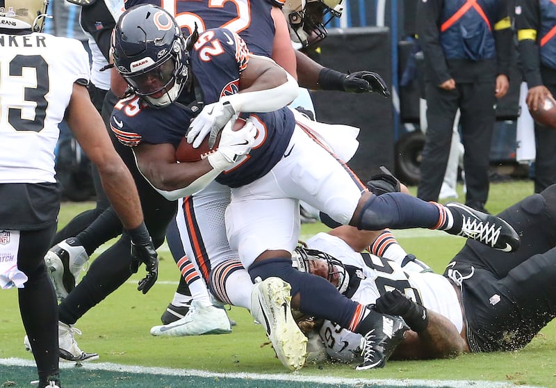 Chicago Bears running back Kyle Monangai pushes toward the goal line as New Orleans Saints defensive end Chase Young blocks on Sunday, Oct. 19, 2025 at Soldier Field in Chicago.