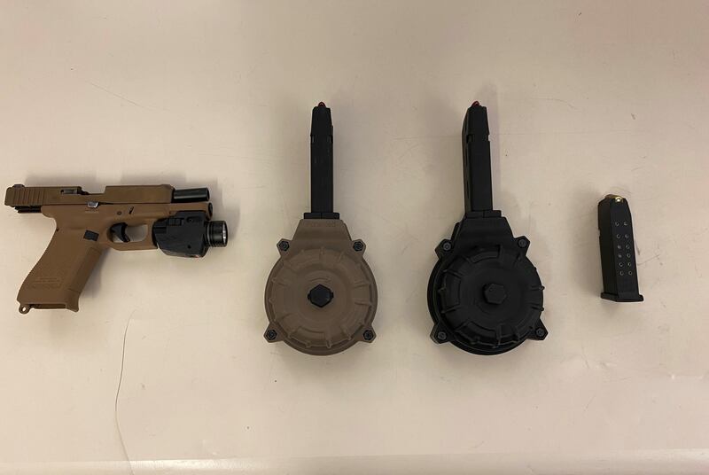The Aurora Police Department released a photo of two handguns and ammunition seized in a traffic stop on Sept. 9.