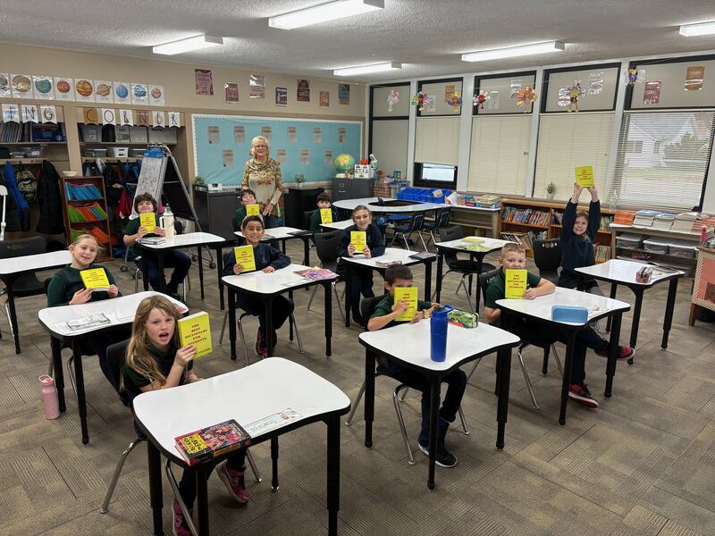 The students in St Andrew's third grade class of teacher Lisa Briniger received their own personal age-appropriate dictionary from Rock Falls Rotarian Cheryl Faber (in back of room)..