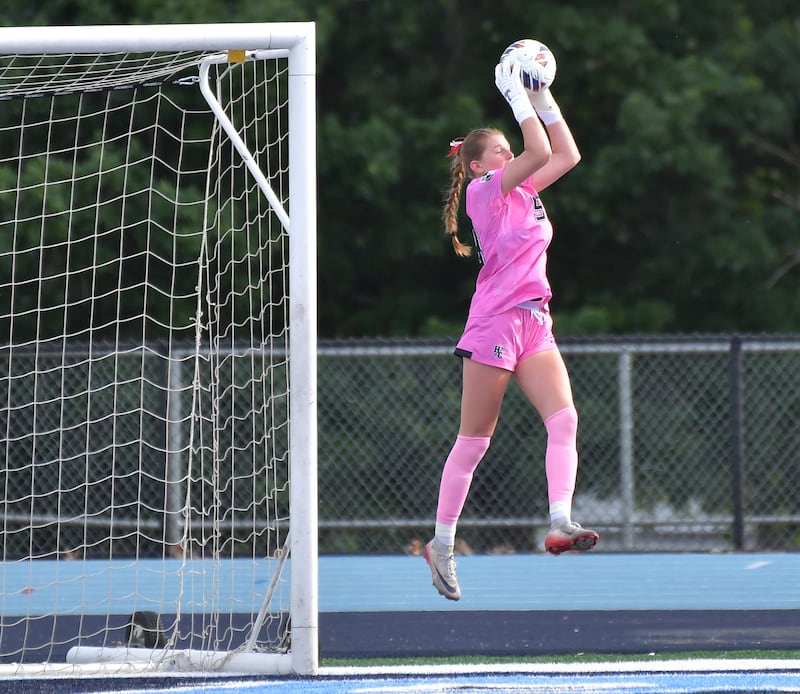 Hinsdale Central goalkeeper Gabby Gjeldum makes a leaping save during the Class 3A Downers Grove South Sectional final against Lyons Township on May 29, 2026 at Downers Grove South High School in Downers Grove .