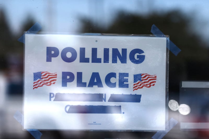 A sign is posted on the door of the McHenry County Election Center on Tuesday, March, 17, 2026, in Woodstock. The Election Center serves as a universal polling place, accessible to all McHenry County voters.