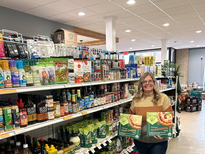 Lori Rumbold, owner and operator of Optimal Health in Princeton, shows off some of her new grocery items.