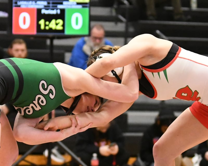 Seneca’s wrestler Samantha Greisen, left, competes against Lasalle-Peru’s Kiely Domyancich during the 125-pound weight class sectional championship match up on Saturday Feb. 14 ,2026, held at DeKalb High School.