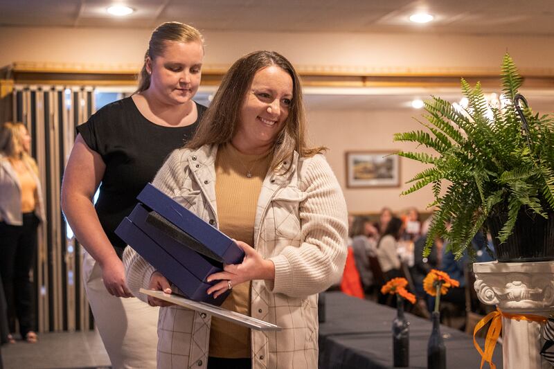 Emily Zimmerman leaves the stage after having been awarded the Pearl Woods Award Thursday, April 18, 2024, at the YWCA Women of Achievement Luncheon. The award goes to a woman who has demonstrated achievement in areas of industry or private business.