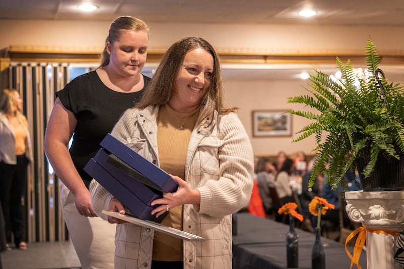 Emily Zimmerman leaves the stage after having been awarded the Pearl Woods Award Thursday, April 18, 2024, at the YWCA Women of Achievement Luncheon. The award goes to a woman who has demonstrated achievement in areas of industry or private business.