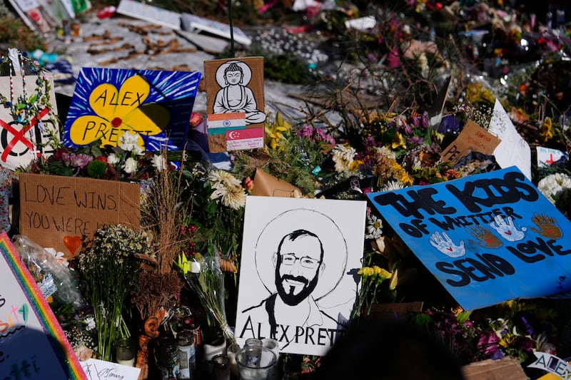 A drawing of Alex Pretti is displayed at the scene where 37-year-old Pretti was fatally shot by a U.S. Border Patrol officer over the weekend, Tuesday, Jan. 27, 2026, in Minneapolis. (AP Photo/Julia Demaree Nikhinson)