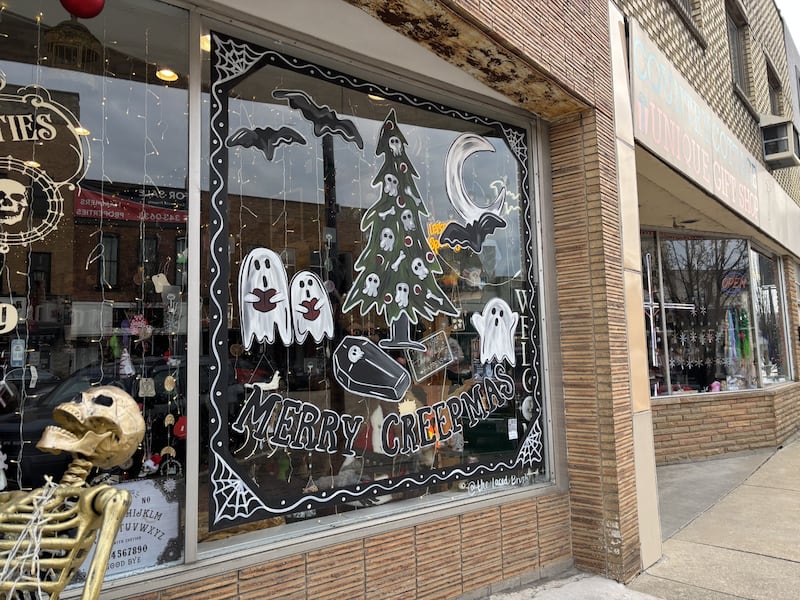 Lacey Haltenhof painted this window for Christmas, but made it a little spooky for Chaos and Curiosities in downtown La Salle.