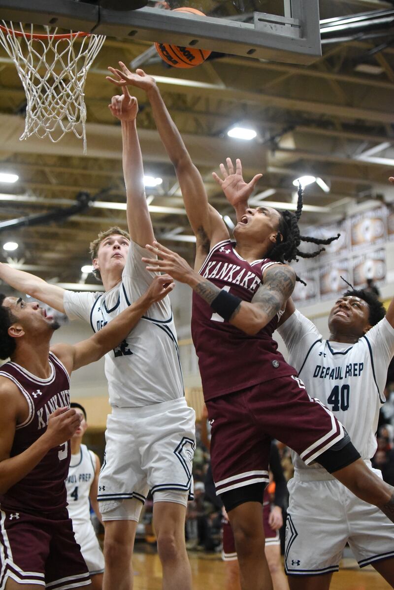 Kankakee's Lincoln Williams, third from right, takes a shot as DePaul Prep's Gus Johnson defends during a game at the Team Rose Shootout at Mount Carmel Sunday, Dec. 14, 2025.