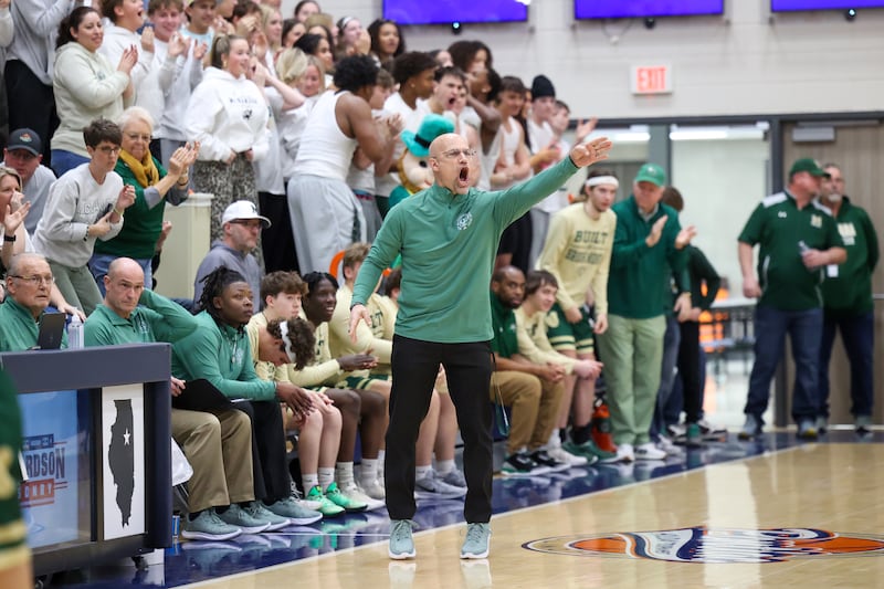 Bishop McNamara head coach Adrian Provost yells to his team during the Fightin' Irish's 77-70 loss to Tolono Unity in the IHSA Class 2A Pontiac Supersectional on Monday, March 9, 20