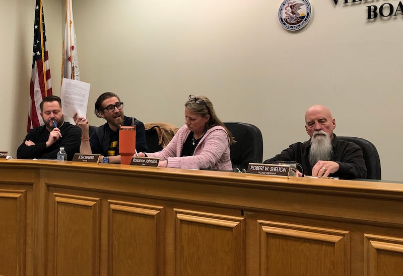 Hebron Trustee Josh Stevens, center, fires questions at Village President Robert Shelton, far right, during a special meeting held Monday, Feb. 3, 2025.