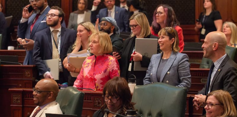 House Democrats surround Rep. Robyn Gabel, D-Evanston, as they vote on the fiscal year 2027 budget in the early hours of June 1, 2026.