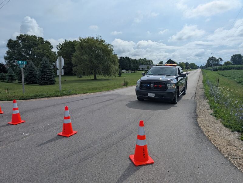 Roads are blocked off in rural Sheridan after authorities have confirmed two people were found dead after first responders rushed to an early-morning fire Thursday in rural Sheridan. A suspect is being sought.