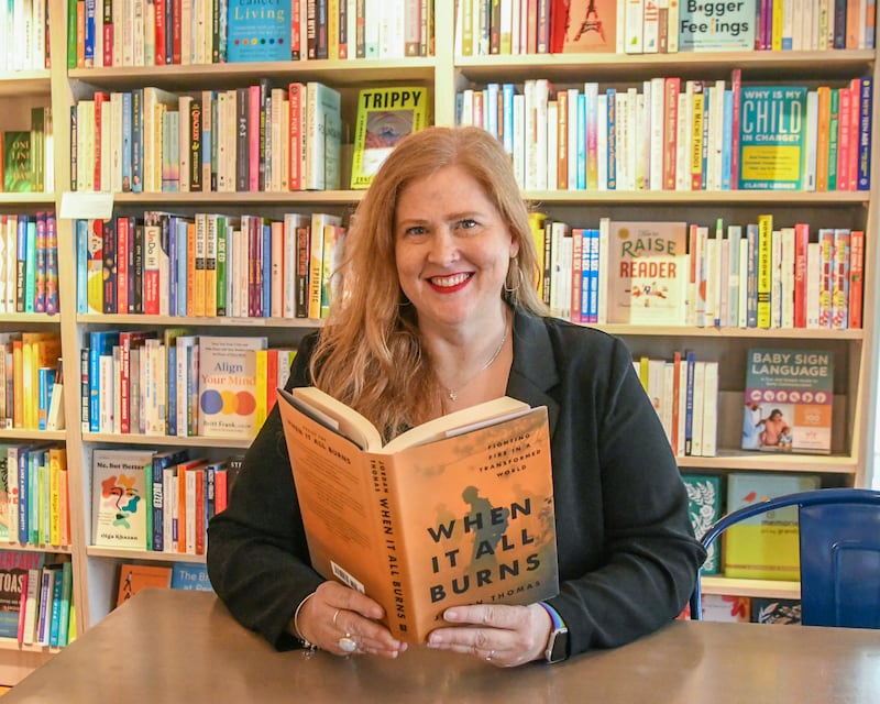 Jen Hall poses for a photo on Friday Oct. 3, 2025, at the Harvey’s Tales bookstore in Geneva.