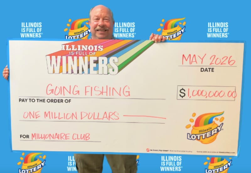 Jerry of Island Lake holds up his $1 million check from the Illinois Lottery after winning the grand prize off a $50 scratch-off ticket.
