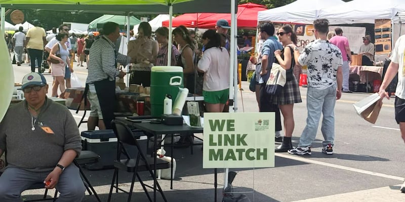 A scene at the station where SNAP users can swipe their EBT card for Link Match vouchers at the Logan Square Farmers Market in Chicago.