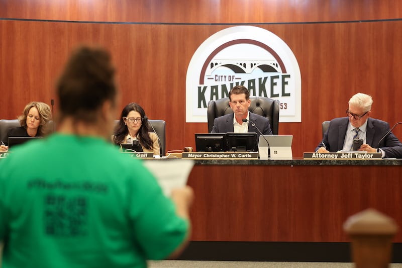 Kankakee Mayor Chris Curtis listens to a Fortitude Community Outreach supporter ahead of the city council's vote on a conditional use permit to allow Fortitude to operate a shelter at 970 E. Court St. in Kankakee during the meeting on Monday, Sept. 15, 2025. The conditional use permit request was rejected by a 12-0 vote.