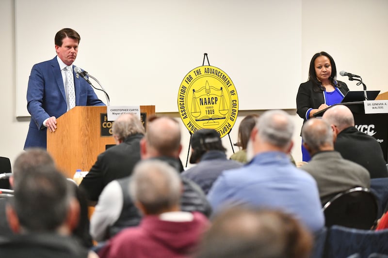 Kankakee Mayor Chris Curtis, left, and Democratic mayoral candidate Genevra Walters listen to a question from the panel during the Kankakee County NAACP Candidates Forum on Tuesday, March 11, 2025, at Kankakee Community College.