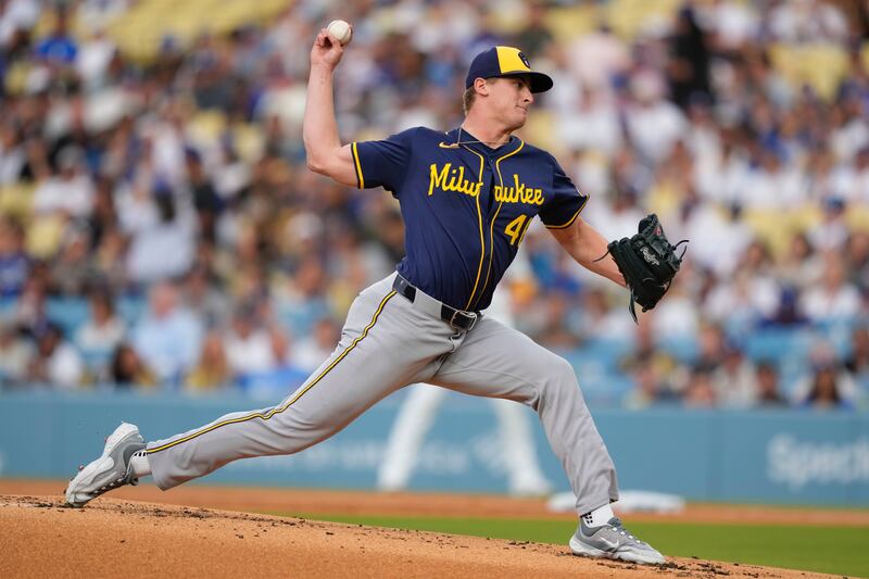 Milwaukee Brewers starting pitcher Quinn Priester throws to the plate during the first inning of a baseball game against the Los Angeles Dodgers, Friday, July 18, 2025, in Los Angeles. (AP Photo/Mark J. Terrill)