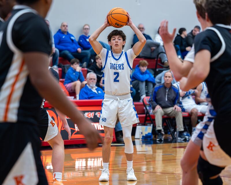 Stihl Brokaw (2) of Princeton holds ball above head looking for pass during the Colmone Classic on Saturday, December 13, 2025 at Hall High School in Spring Valley.