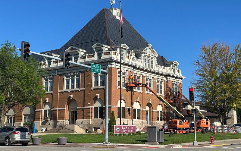 Crews work on tuck-pointing bricks on the exterior of the La Salle City Hall on Tuesday, April 30, 2024.