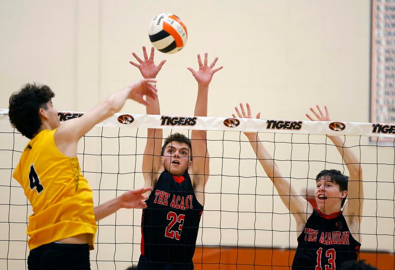 Metea Valley’s Ryan Da Silva (4) tries to spike the ball past Benet Academy’s Luke Mitr (23) and Owen Sweeney (13) during the Wheaton Warrenville South Tiger Classic boys volleyball tournament Saturday, April 19, 2025 in Wheaton Ill.