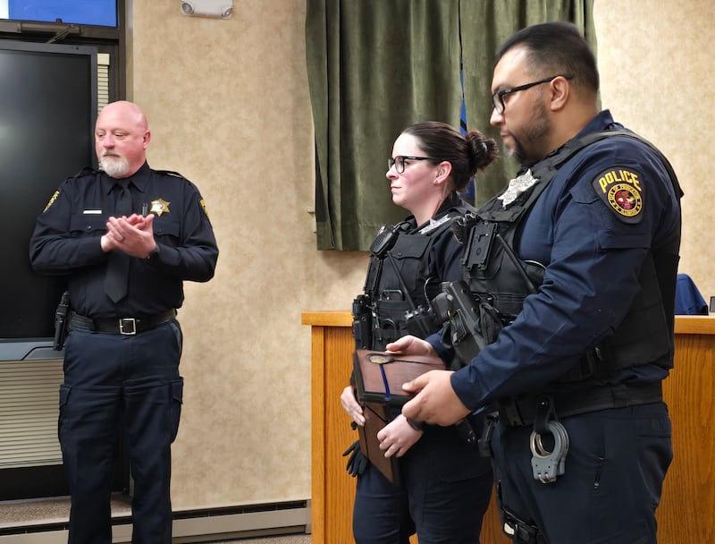 Princeton police officers Kelsey Kowalski (left) and Alejandro Jaramillo were honored Tuesday, March 4, 2025, during the Princeton City Council meeting.