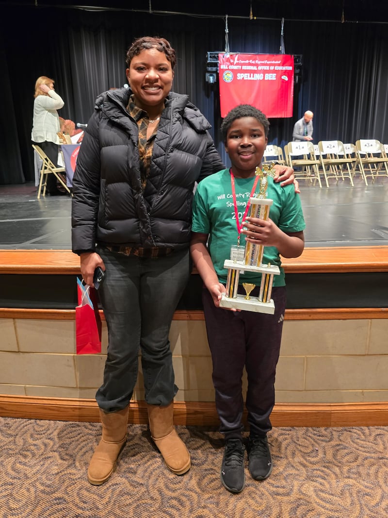 Crete-Monee Middle School 6th Grader Kingston McGhee and his mother celebrate his regional spelling bee win on Tuesday, March 17, 2026.