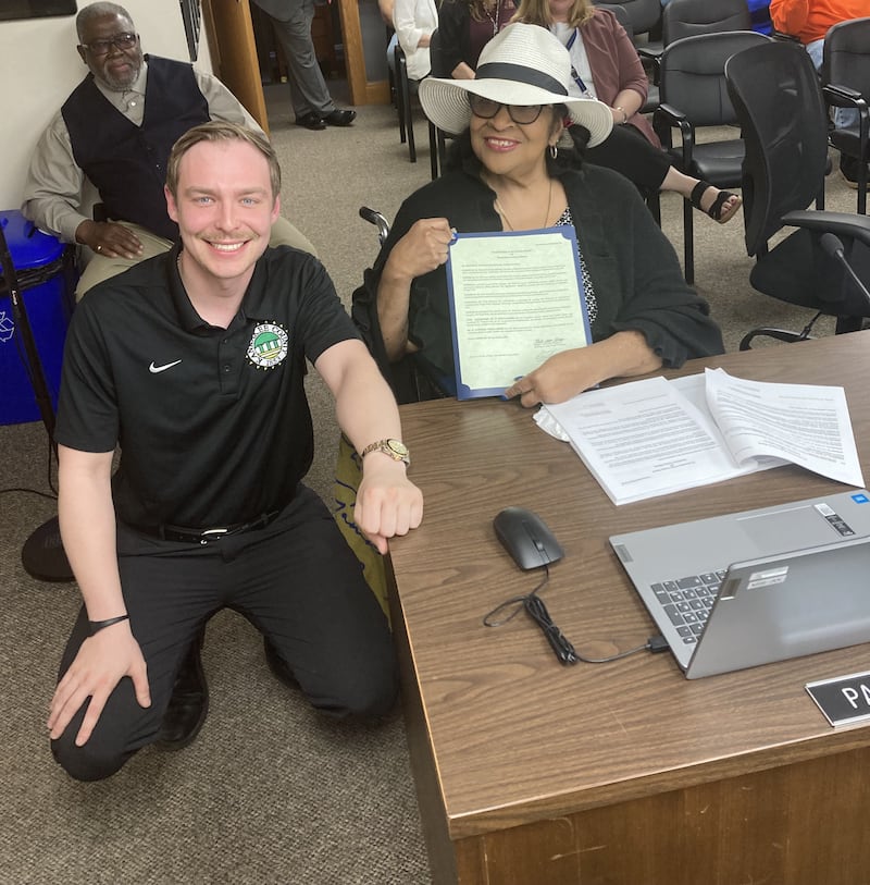 Kankakee County Board member Patricia Polk, right, holds a copy of her proclamation by the Board, honoring her for her decades of community service and civic engagement. At right is Board President Matt Alexander-Hildebrand.