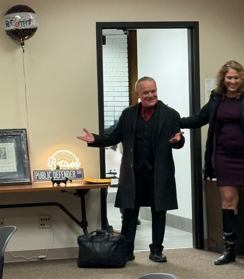McHenry County Public Defender Mark Cook walks into his surprise retirement party on Jan. 30, 2026, in the McHenry County Sheriff's Office training room. Friends, family and colleagues attended to wish Cook farewell after he served nearly 40 years as head of the office. His longtime chief investigator Coral Drzewiecki walked him into the surprise party.