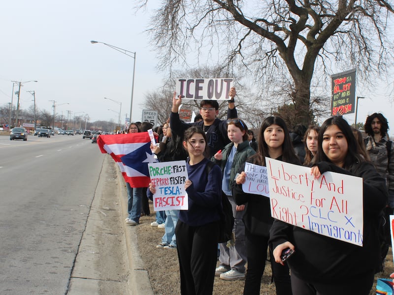 Crystal Lake Central Students hold up signs protesting against Immigration and Customs Enforcement along Route 14 on Feb. 9, 2026.