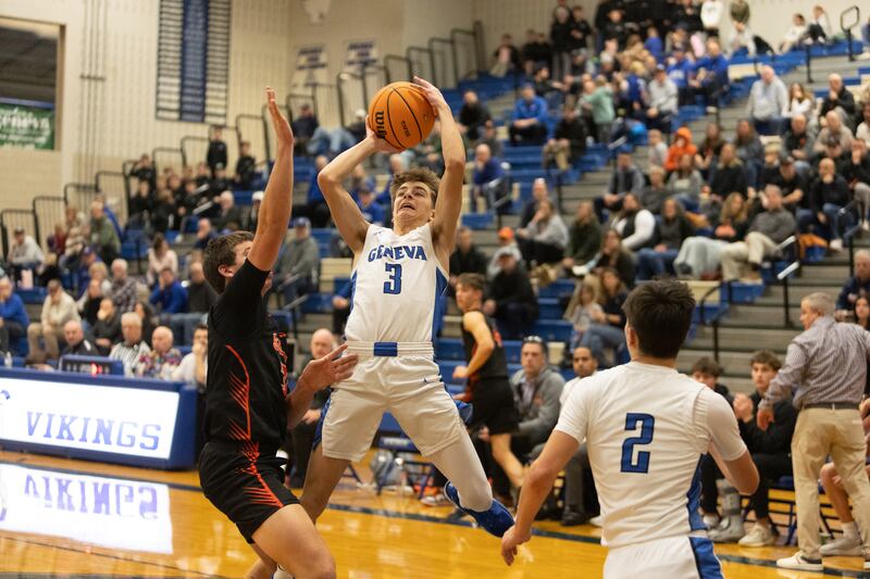 Geneva's Nathan Palmer shots a jumper against Wheaton Warrenville South on Wednesday, Dec.10,2025 in Geneva.