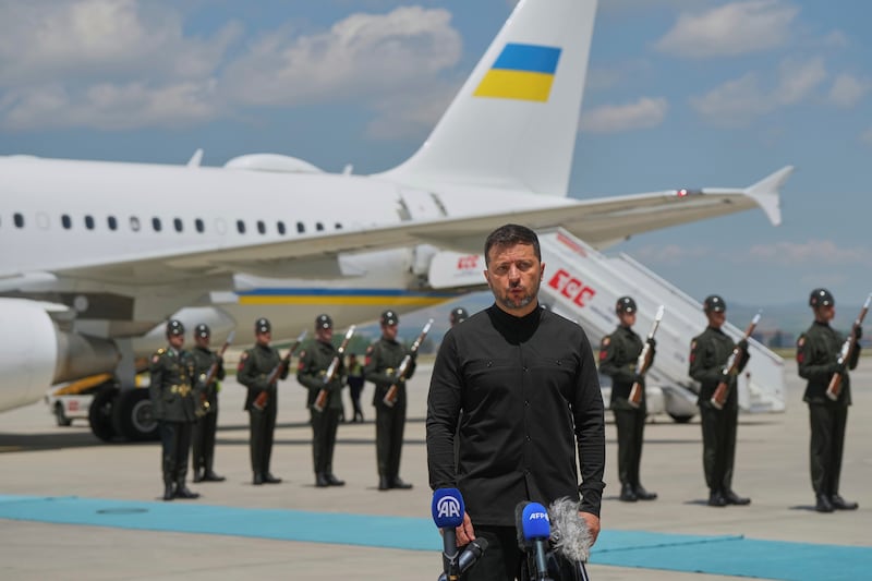 Ukrainian President Volodymyr Zelenskyy talks to journalists as he arrives at Esenboga airport in Ankara, Turkey, Thursday, May 15, 2025. (AP Photo/Evgeniy Maloletka)