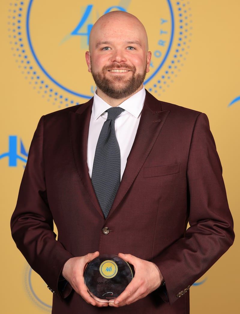 John Scholtes poses with his 40 Under Forty award during the Illinois Valley Chamber of Commerce Champions of Change Awards Night on Thursday, April 10, 2025 at the Westclox Event Center in Peru.