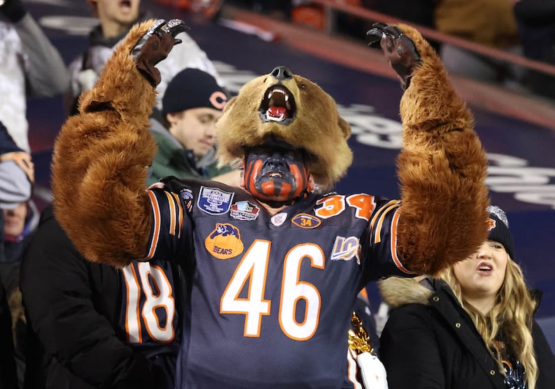 Don Wachter, of Plainfield, cheers on the Bears dressed in his Bearman costume Saturday, Jan. 10, 2026, during the Chicago Bears NFL Wild Card game against the Green Bay Packers.