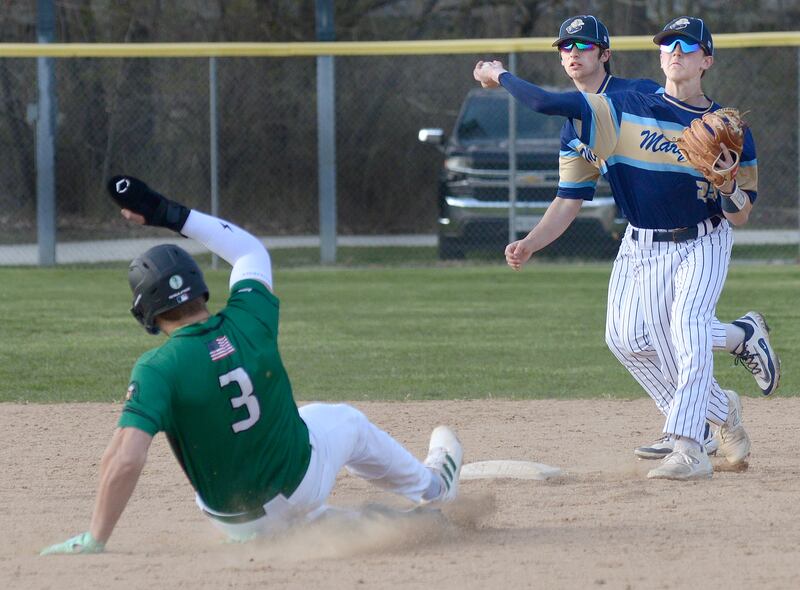Marquette’s Griffin Dobberstein completes a double play as Dwight’s Luke Gallet attempts to break it up Thursday at Masinelli Field in Ottawa