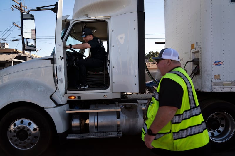 FILE - A student driver gets on a truck as the instructor watches in Calif., Nov. 15, 2021. (AP Photo/Jae C. Hong, File)