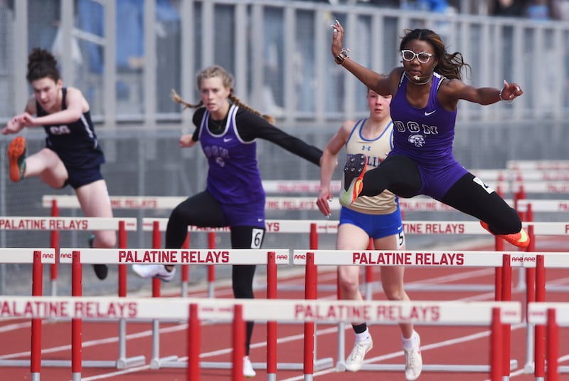 Downers Grove North’s Ava Flynn wins the 100-meter hurdles during the Palatine girls track and field invitational on Saturday, April 26, 2025 in Palatine.