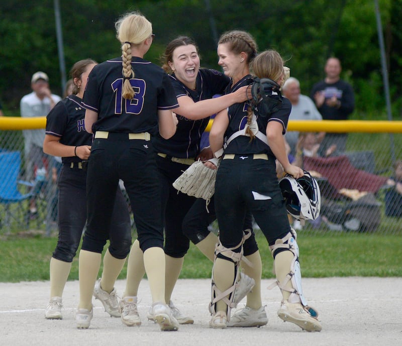 Serena’s Lady Huskers celebrate their win after the final out against Marquette Friday at Serena.