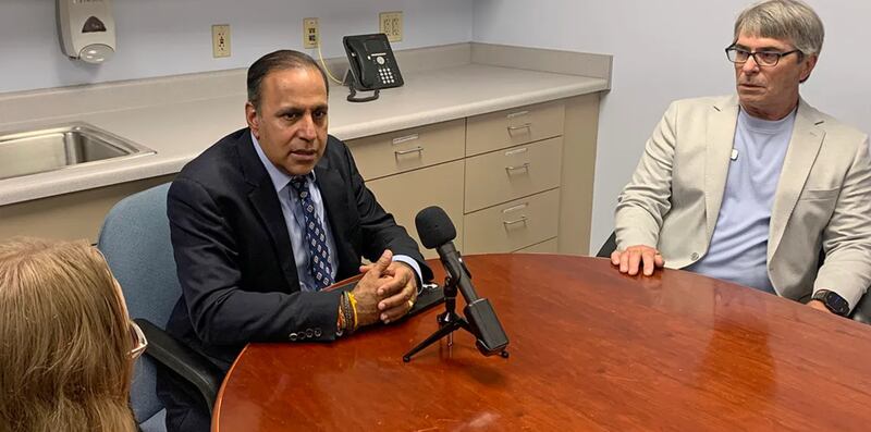 U.S. Rep Raja Krishnamoorth, left, meets with independent pharmacy owners, including Dave Bagot of Petersburg Pharmacy (right) in Petersburg on Friday, July 11, 2025.