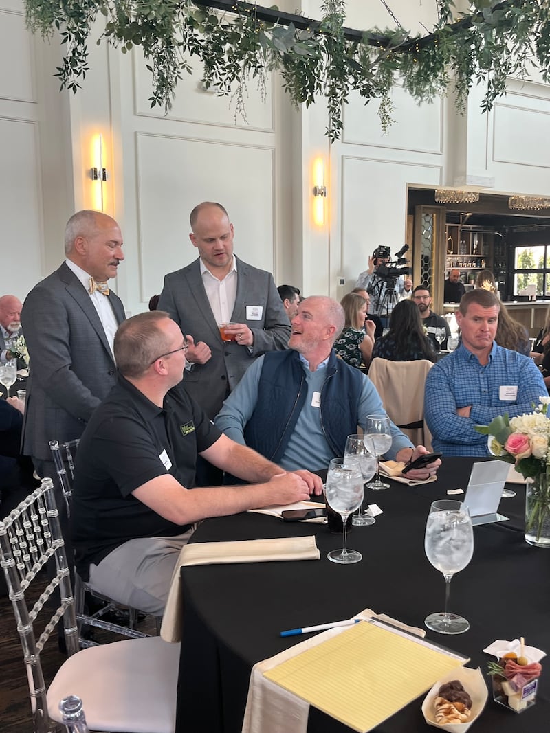 Plainfield Mayor John F. Argoudelis (left) speaks with attendees at the annual State of the Village address hosted by the Plainfield Junior Woman’s Club at Plainfield Farmhouse on March 12, 2025.