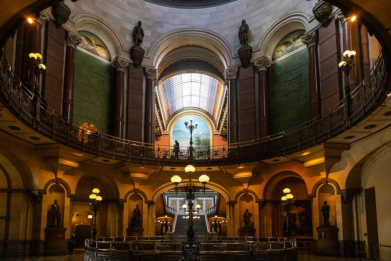 The view outside the governor’s second-floor office in the Illinois State Capitol building in Springfield. Above, the larger rail separates the House and Senate chambers.