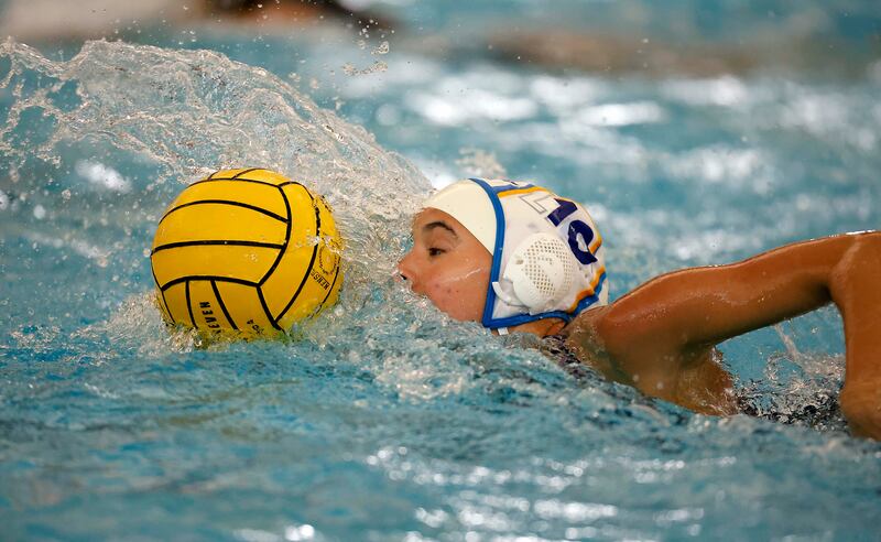 Lyons Township's Avery Watanabe (10) moves the ball forward during the IHSA State Finals of the Girls Water Polo Saturday, May 24, 2025 at Stevenson High School in Lincolnshire.