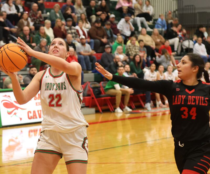 L-P's Brianna Ruppert eyes the hoop while running in the lane over Hall's Natalia Zamora to score on a layup on Monday, Jan. 12, 2026 in Sellett Gymnasium at L-P High School.
