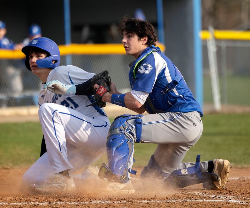 Newman’s Michael Morse is tagged out at home by Princeton’s Ace Christiansen on a close play Thursday, April 10, 2025.
